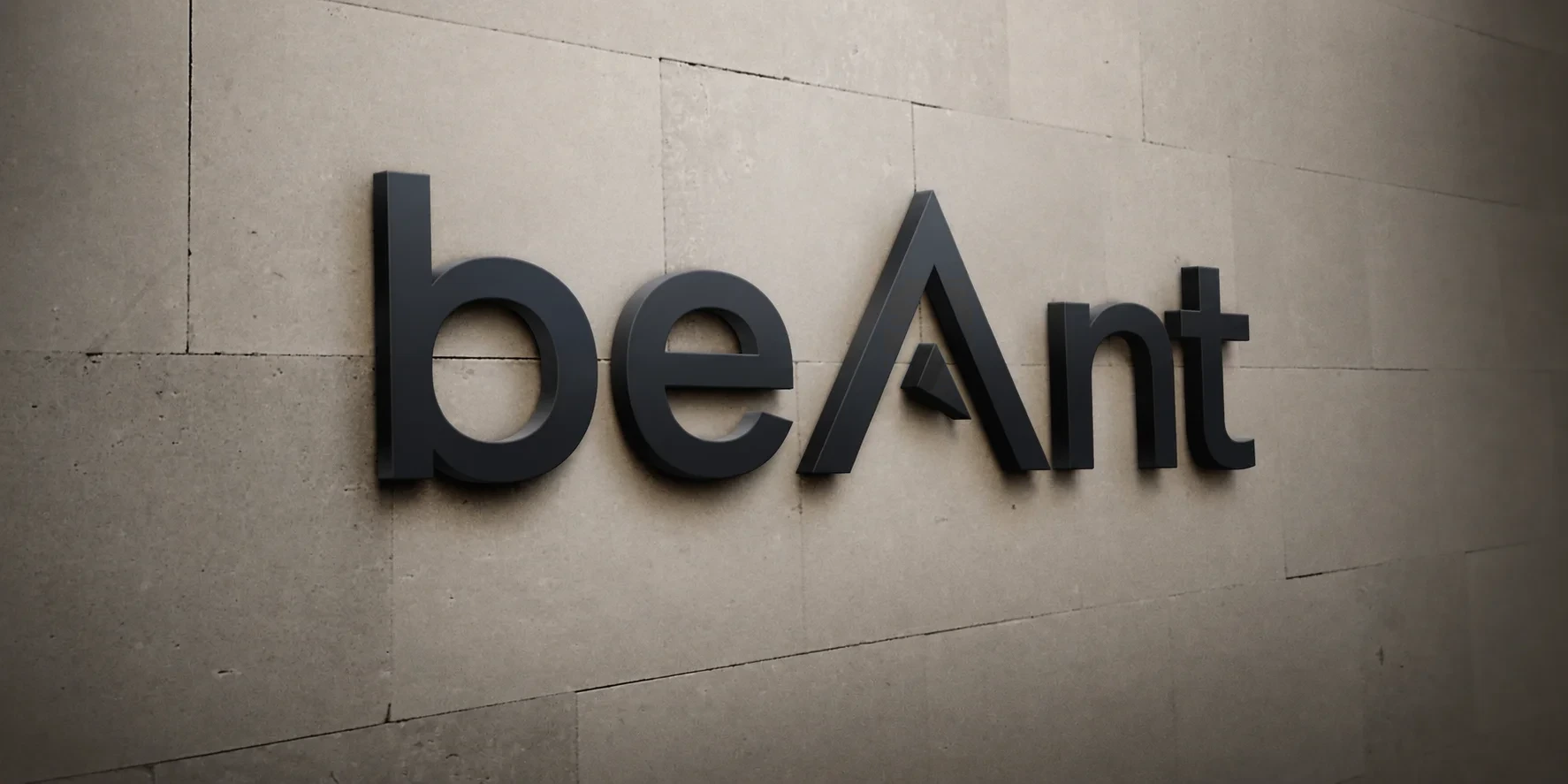 The beAnt logo sign mounted on a stone wall